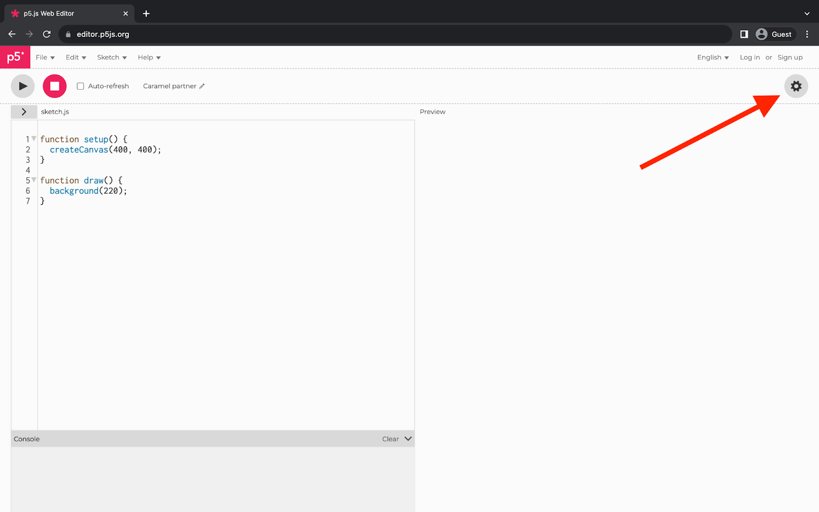 p5.js Webエディタを表示しているウェブブラウザ。ウェブページの左上にある歯車アイコンに赤い矢印が指しています。